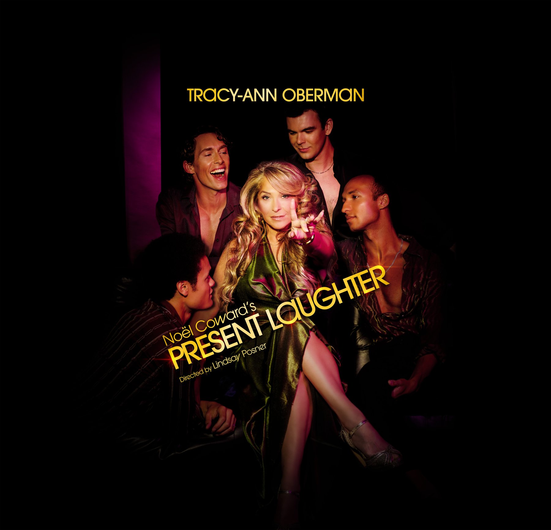 A glamorous woman in a gold dress sits between men who are looking at her in admiration