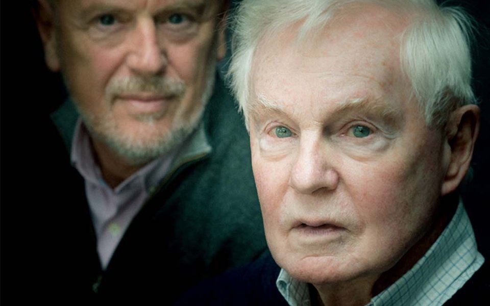 In the foreground we see Derek Jacobi's face in a subtle spotlight