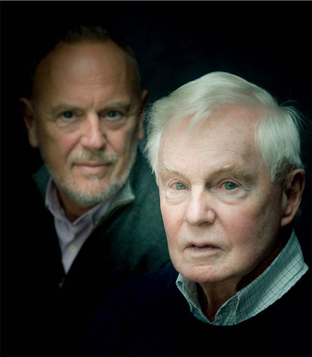 In the foreground we see Derek Jacobi's face in a subtle spotlight