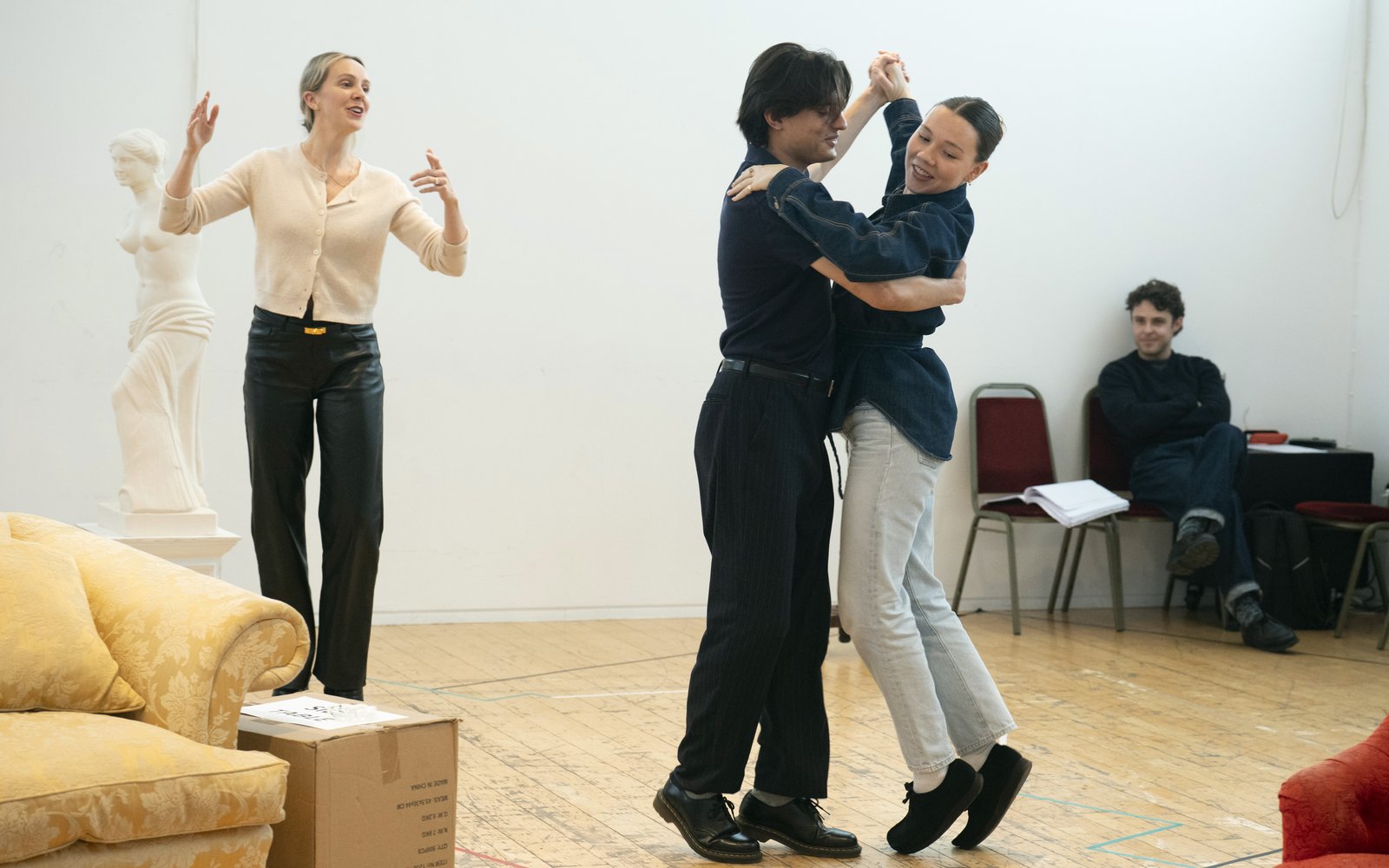 A man and a woman dance together