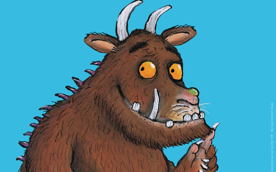 A brown creature with horns and a green nose with purple spined back