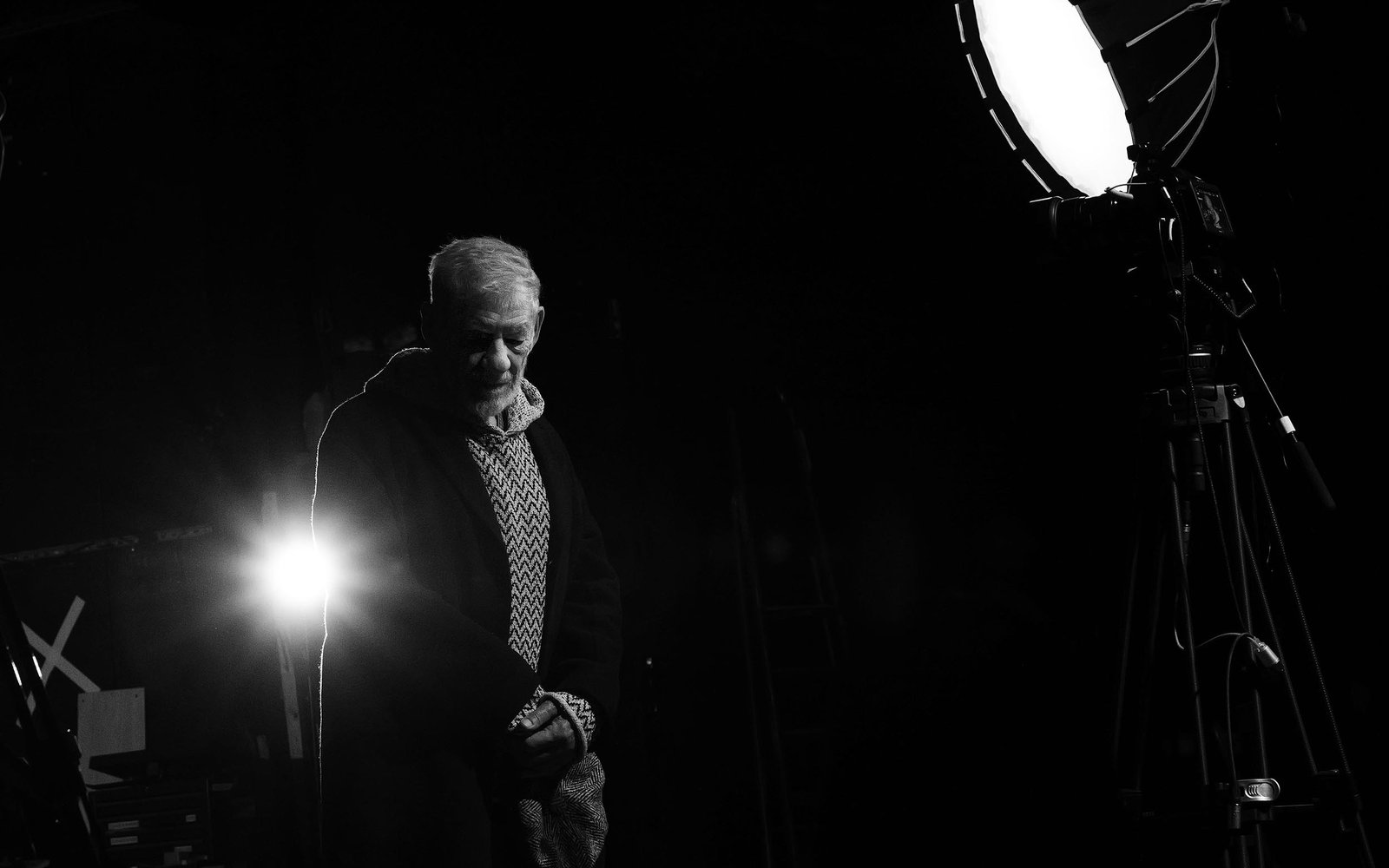 Sir Ian McKellen stands on The Arts Theatre stage prior to building works commencing (photography by Michael Johnson)