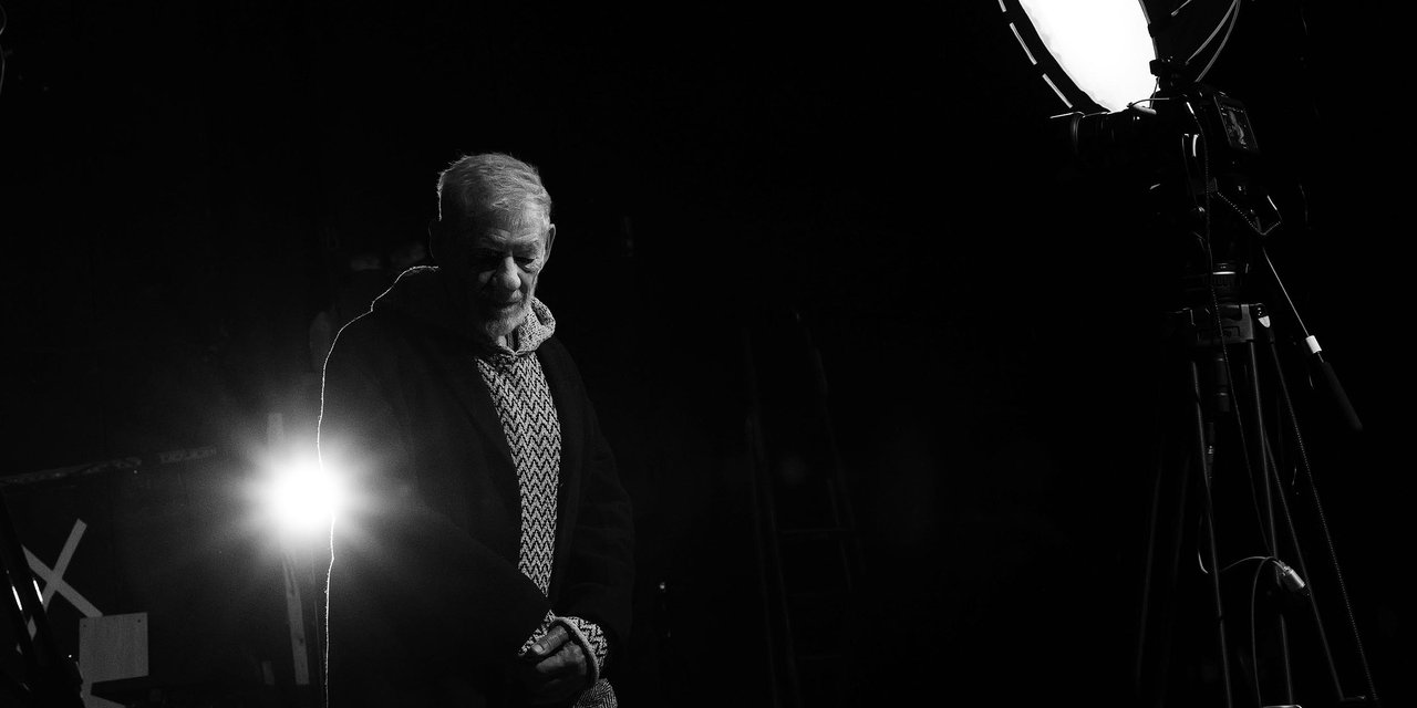 Sir Ian McKellen stands on The Arts Theatre stage prior to building works commencing (photography by Michael Johnson)