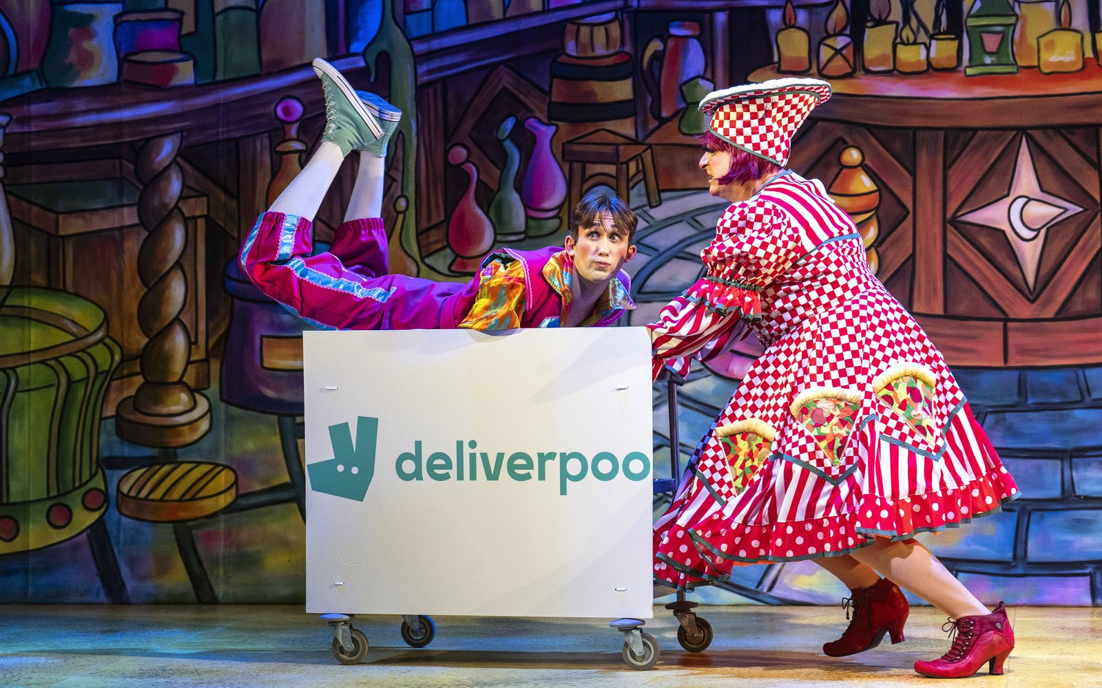 Nanny Nutkins pushes Happy Harry on a deliveroo trolley